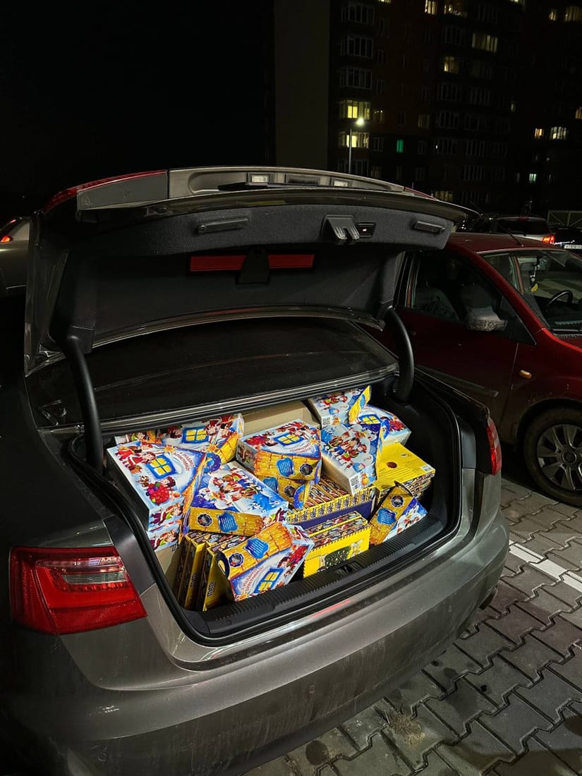 A car boot full of Christmas gift boxes for Ukrainian children